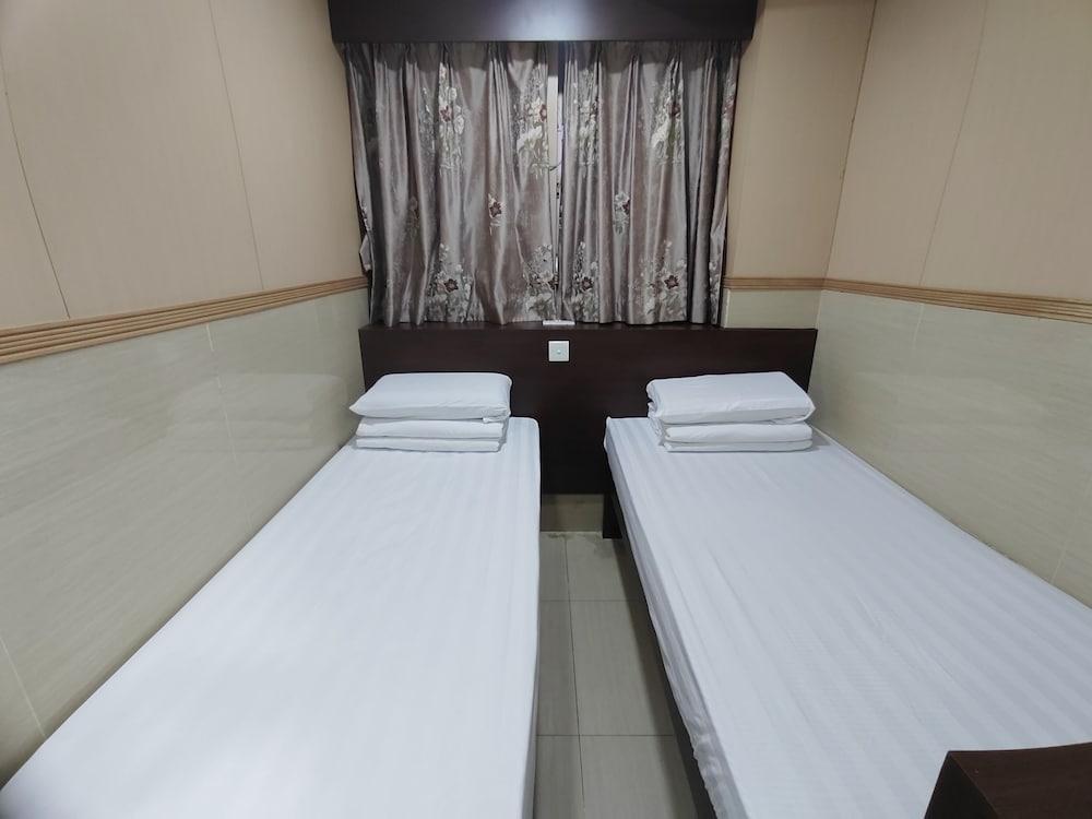 Kam Fu Guest House - Tap to explore photos