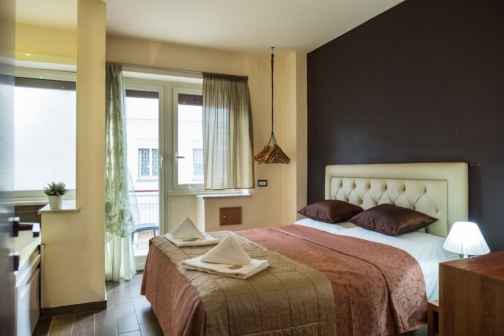 Aida Charming Rooms - Tap to explore photos