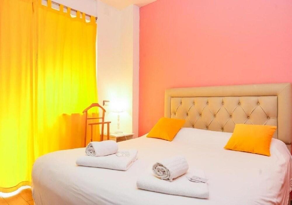 Aida Charming Rooms - Tap to explore photos