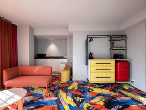 ADGE Hotel & Residences - Tap to explore photos
