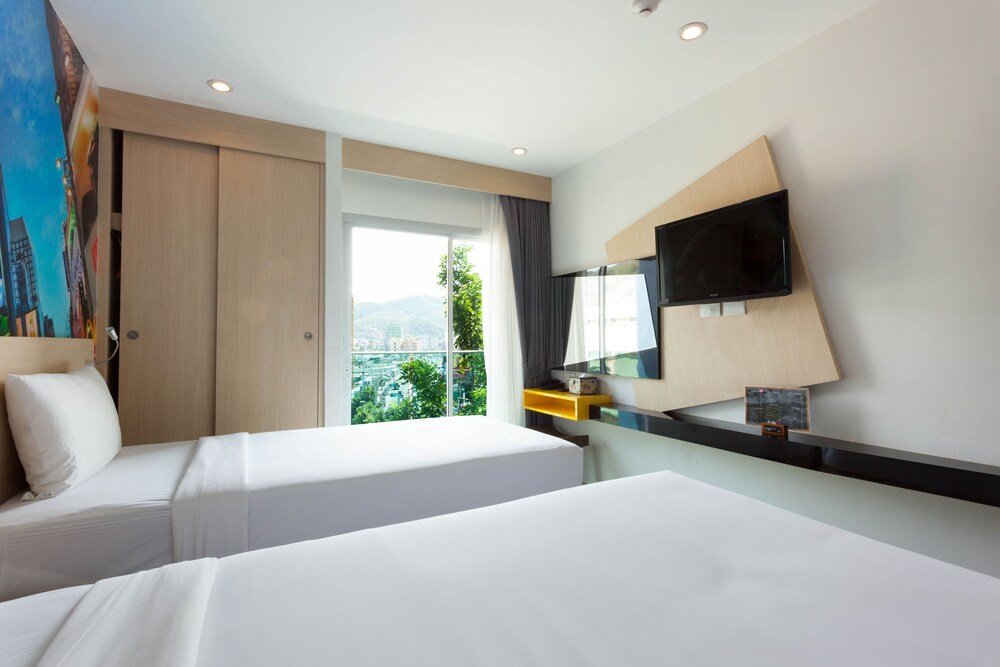 The AIM Patong Hotel - Tap to explore photos