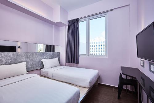 ibis budget Singapore Pearl - Tap to explore photos