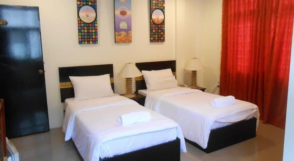 The Bang Khun Phrom Suites - Tap to explore photos