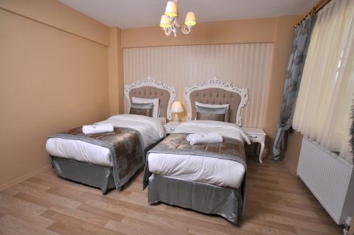 Divani Ali Hotel Room Type - Family Room - Basement - No Window Divani Ali Hotel Room Type - Family Room - Basement - No Window