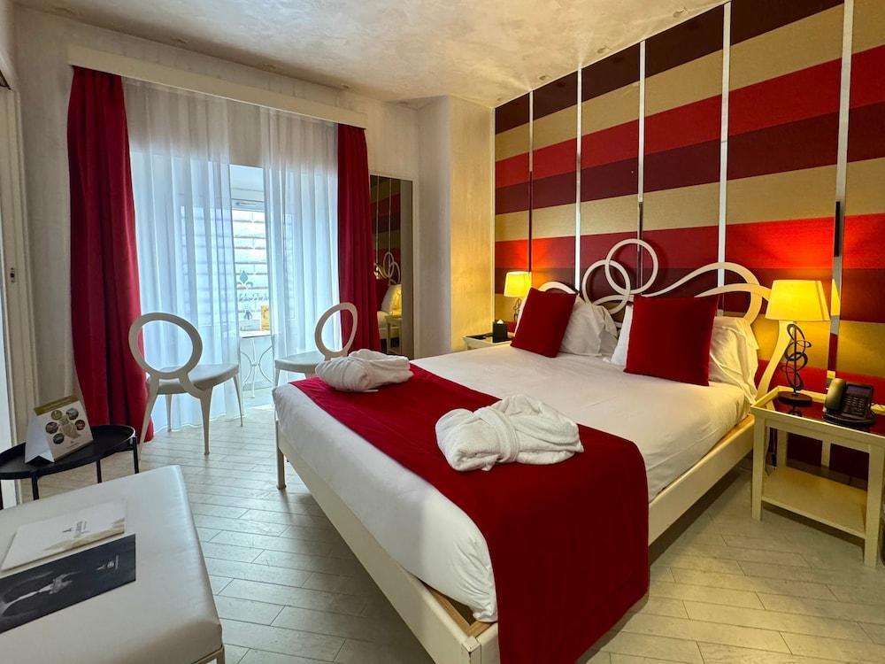 Hotel Caravita - Tap to explore photos