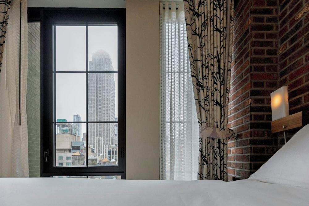 Archer Hotel New York Room Type - Archer King Empire view Mobility and Hearing Accessible Guest Room w Transfer Shower Archer Hotel New York Room Type - Archer King Empire view Mobility and Hearing Accessible Guest Room w Transfer Shower