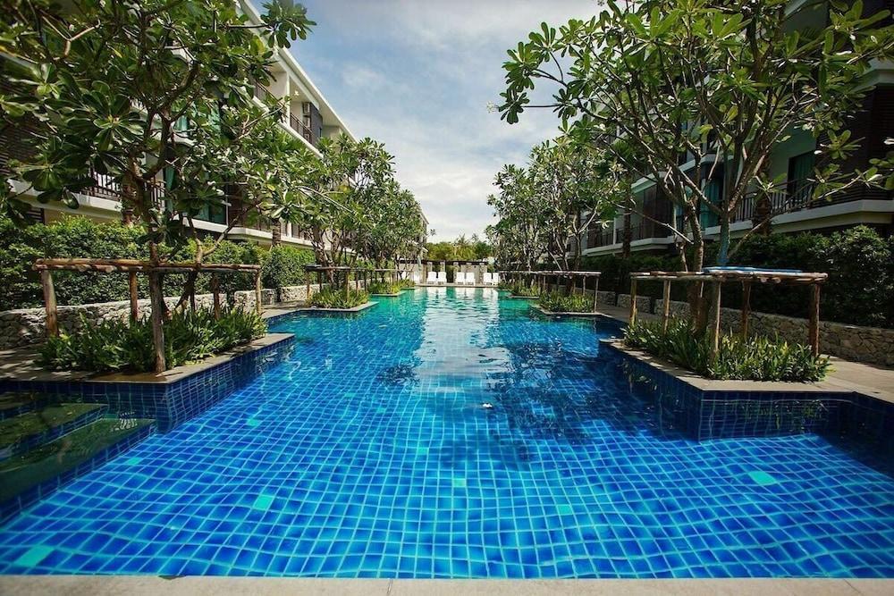 The Title Condo by TropicLook - Tap to explore photos