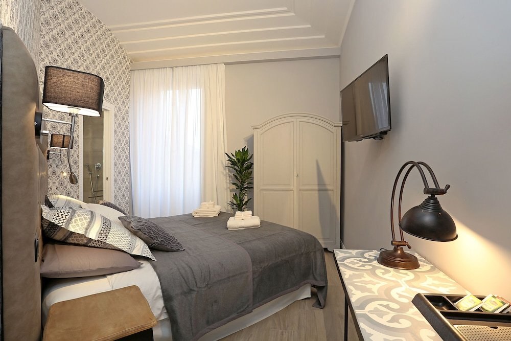Capricci Romani Room Type - Deluxe Quadruple Room, 1 Bedroom, Refrigerator