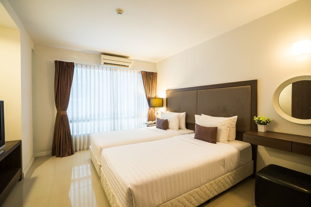 Beyond Suite Hotel - Tap to explore photos