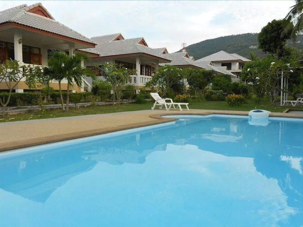 Krisada Beach Resort - Tap to explore photos