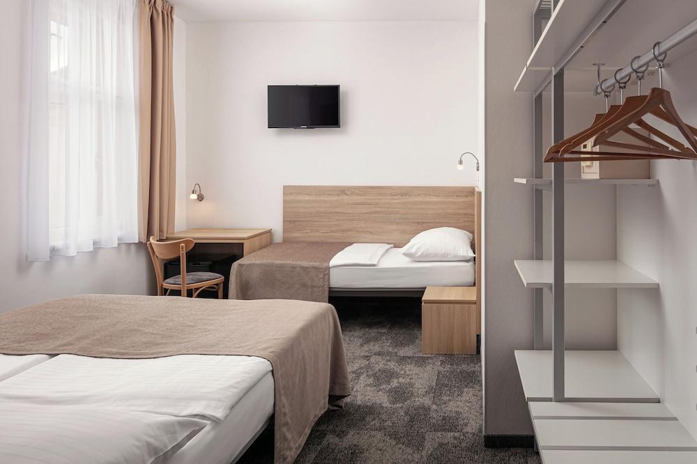 Hotel Ambiance Room Type - Standard Triple Room (Double with Extra bed)
