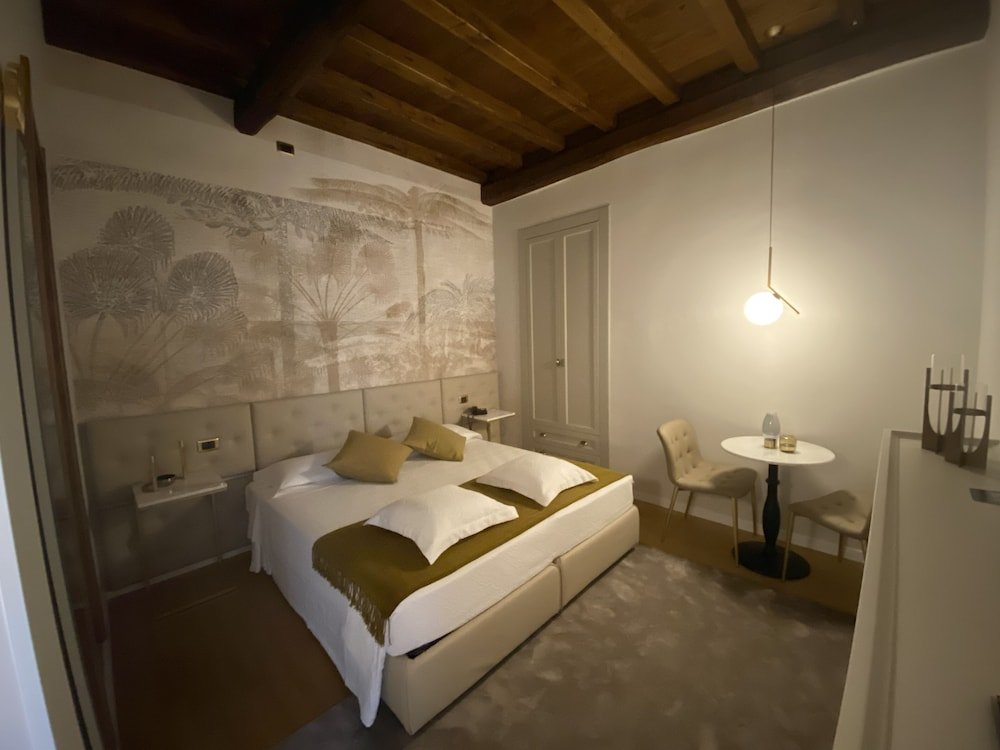 Condotti Rooms - Tap to explore photos