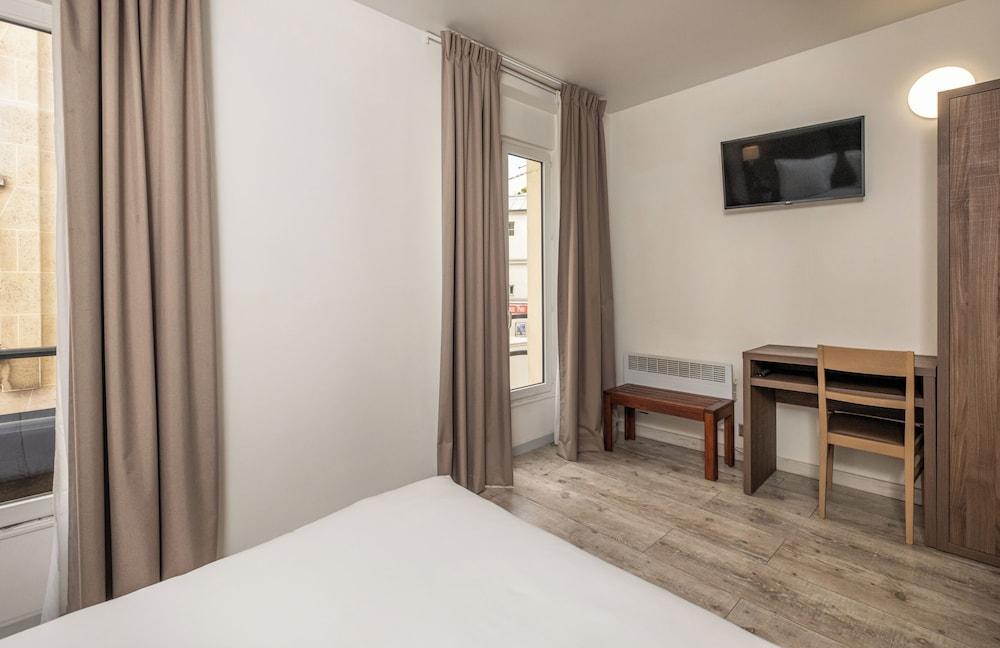 Hotel La Perle Montparnasse - Tap to explore photos