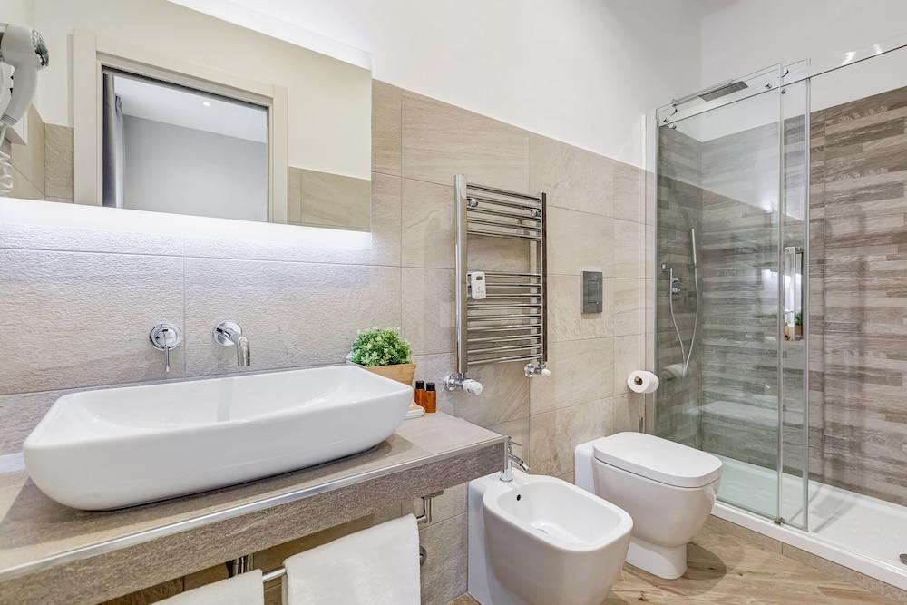Colonna Luxury Suites - Tap to explore photos