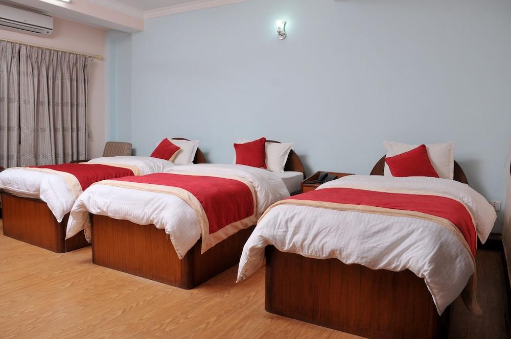 Hotel Brihaspati Room Type - Deluxe Triple Room, 3 Bedrooms Hotel Brihaspati Room Type - Deluxe Triple Room, 3 Bedrooms