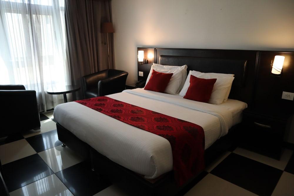 Easy Inn Hotel Suites - Tap to explore photos