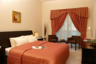 Al Raya Hotel Apartments - Tap to explore photos