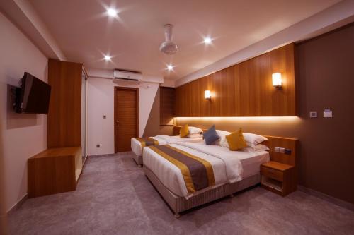 Kuredhi Beach Inn Room Type - Deluxe Triple Room