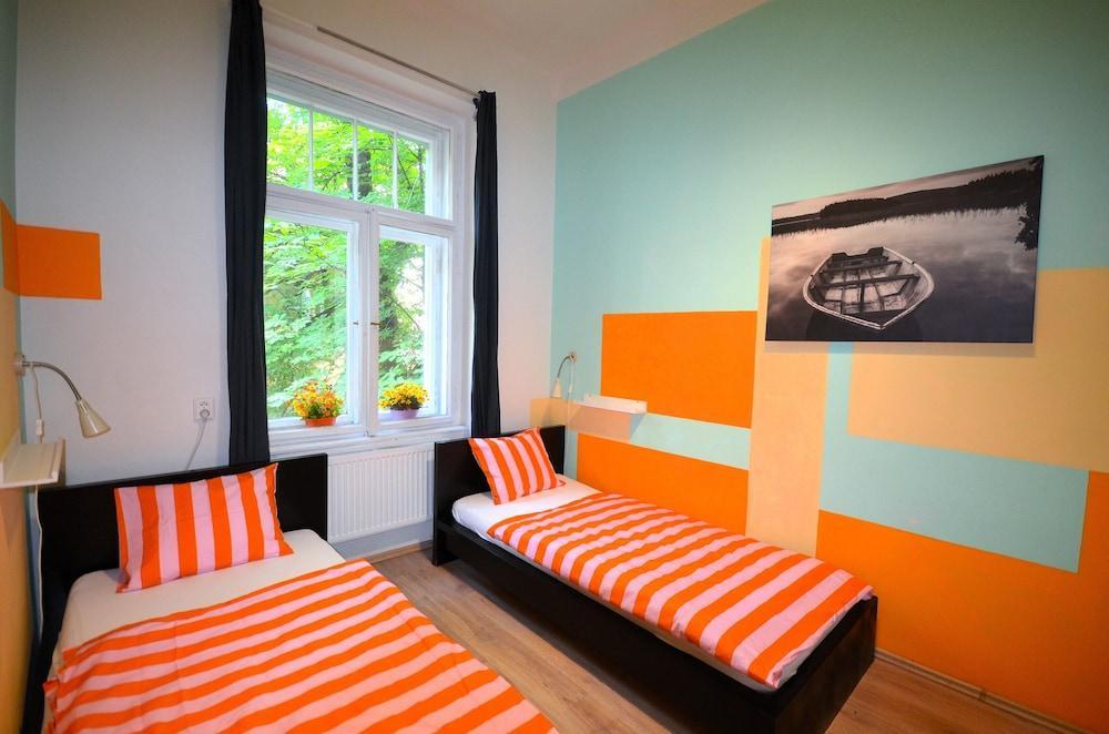 Travel & Joy backpackers Room Type - City Twin Room, Kitchen, Courtyard View