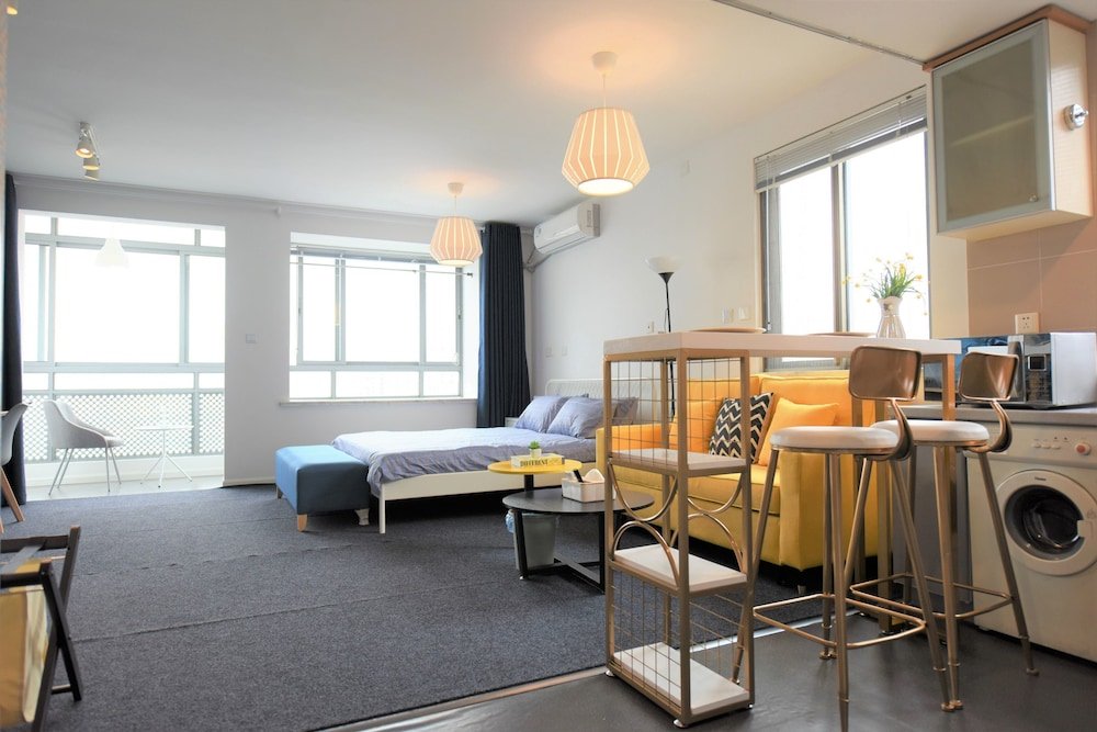 Your Saint Land Service Apartment - Tap to explore photos