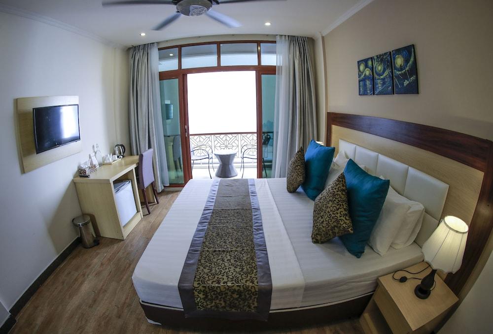 Triton Beach Hotel & Spa - Tap to explore photos