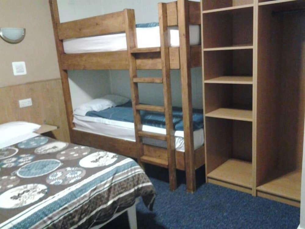 MacDonald Room Type - Family Room, Multiple Beds, Private Bathroom, Courtyard View