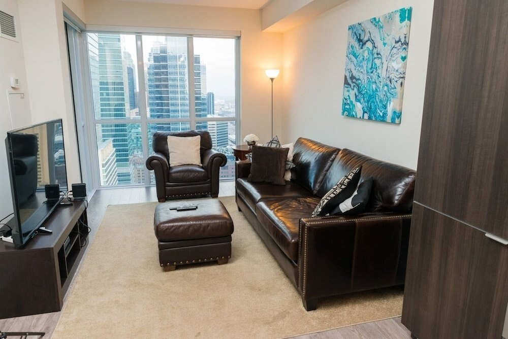 Sarkar Suites - CN Tower Rogers Centre - Tap to explore photos