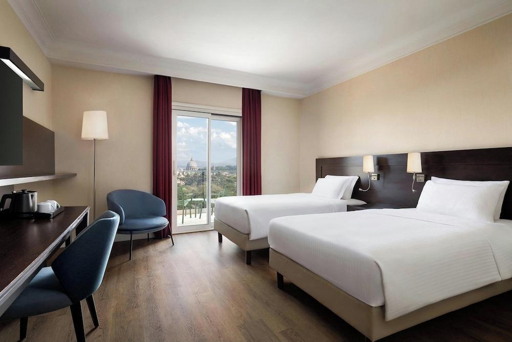 Courtyard by Marriott Rome Central Park - Tap to explore photos