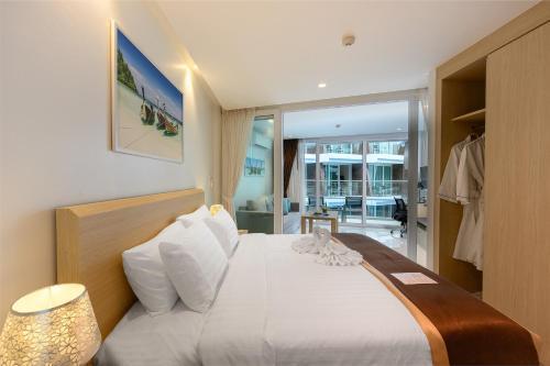 The Beachfront Hotel Phuket - Tap to explore photos