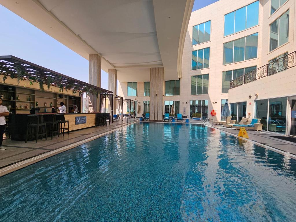 DoubleTree by Hilton Doha - Al Sadd - Tap to explore photos