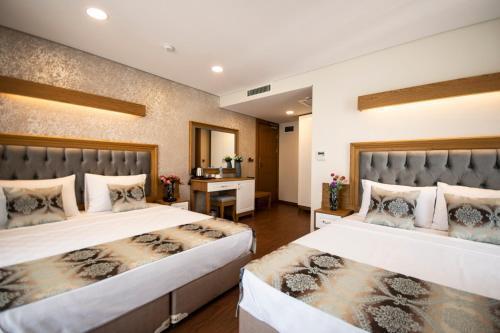 Eliza Hotel Room Type - Standard Triple Room Eliza Hotel Room Type - Standard Triple Room