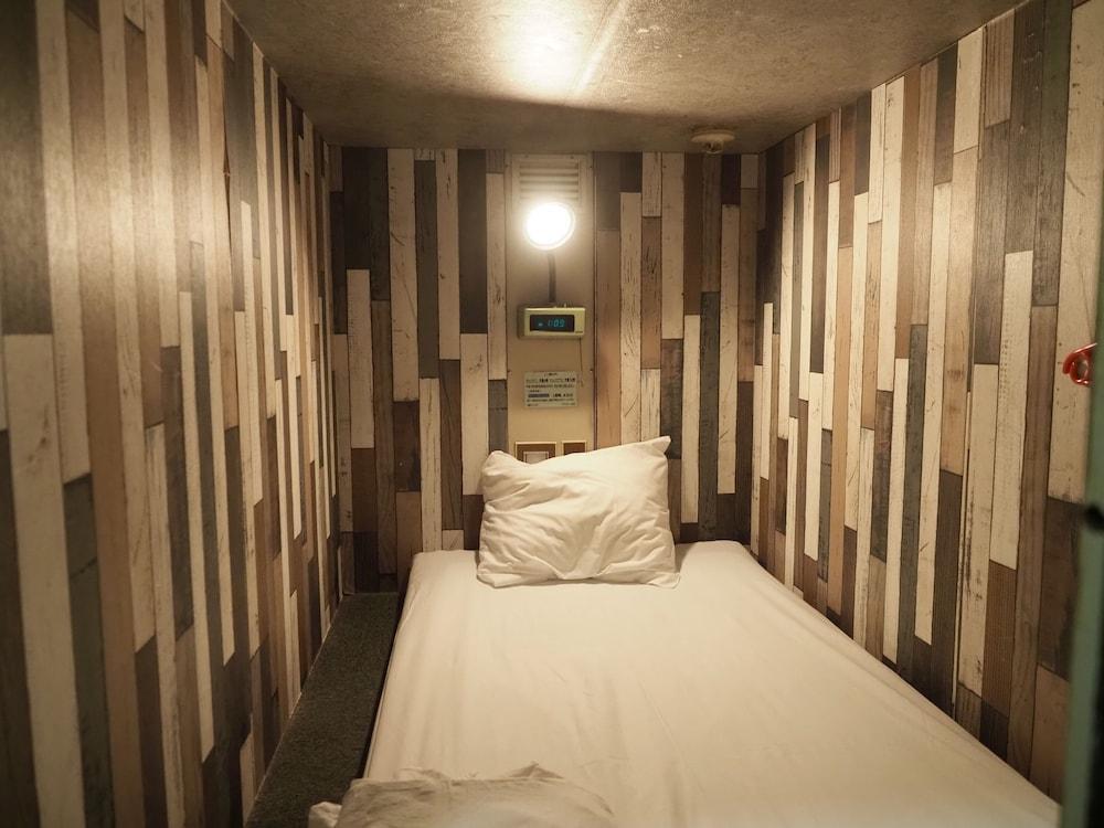 Capsule Hotel Block Room - Tap to explore photos