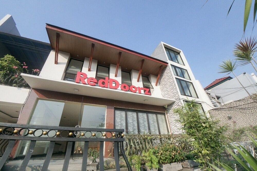 RedDoorz Plus near Green Pramuka Square Mall - Tap to explore photos