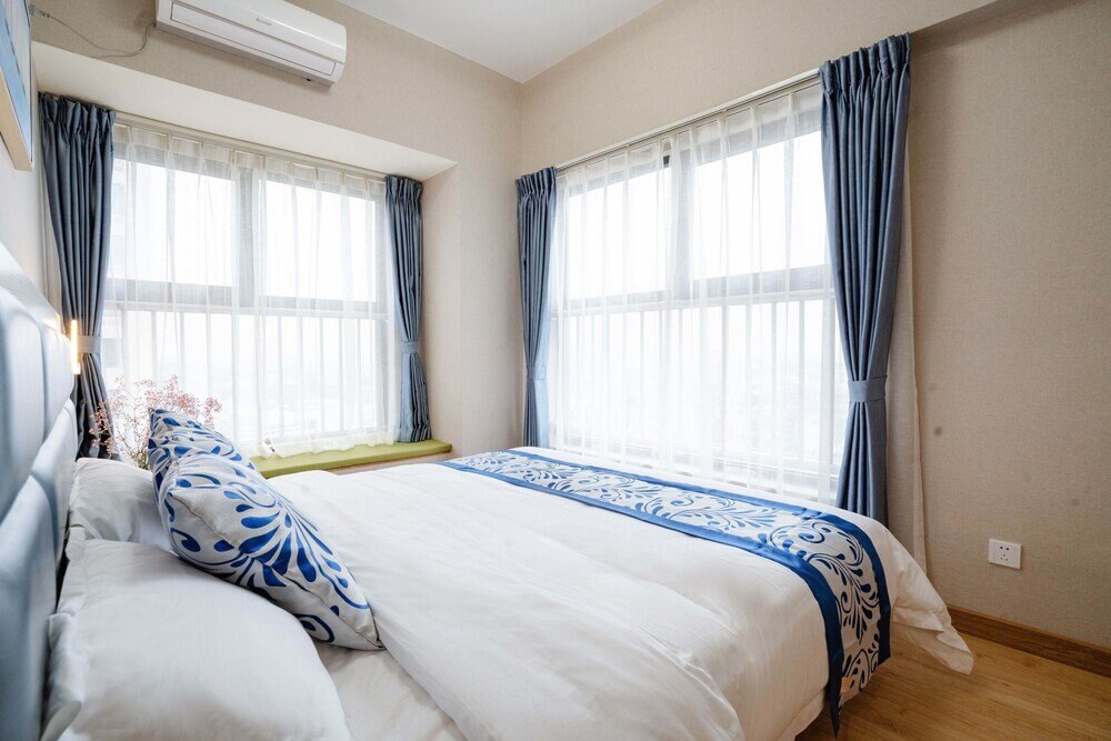 Yue Tu Apartment Hotel - Tap to explore photos