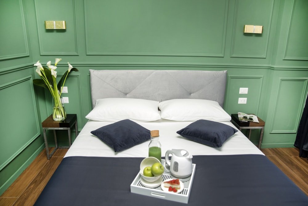 Unicum Roma Suites - Tap to explore photos