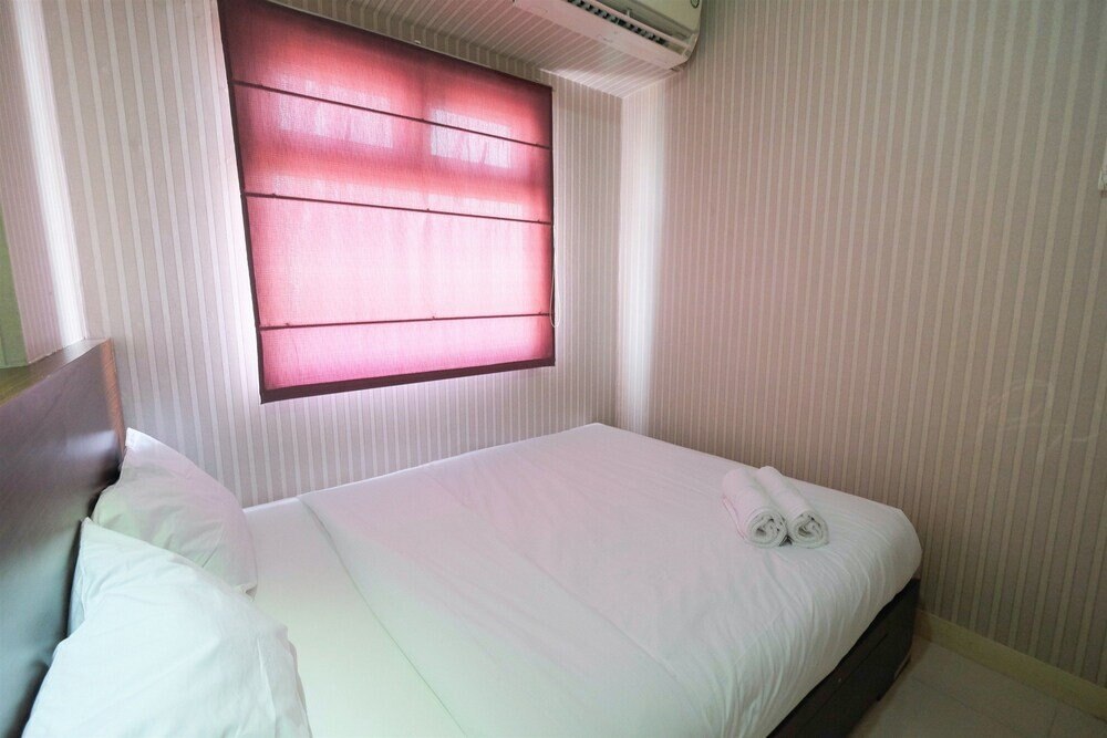 Homey and Relaxing 2BR Green Pramuka Apartment