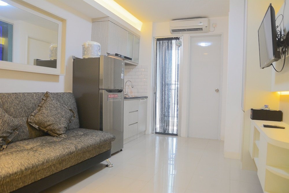 Pool View 2BR with Sofa Bed Bassura City Apartment - Tap to explore photos