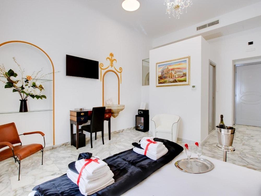 Queen Palace Suites - Tap to explore photos