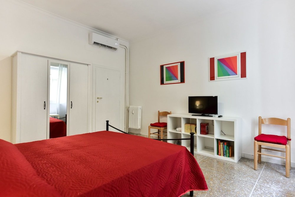 Red & White Vatican Apartment - Tap to explore photos