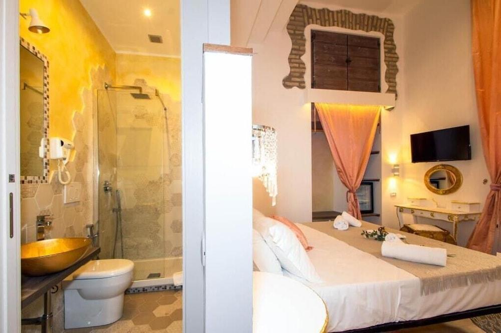 Roma Charming Rooms - Tap to explore photos