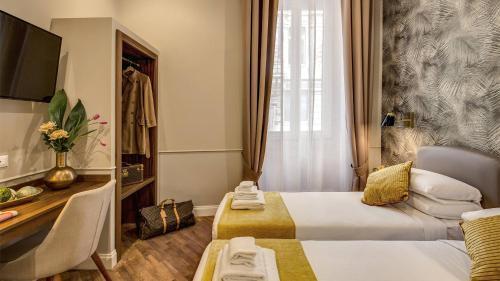 Charme Spagna Boutique Hotel - Tap to explore photos