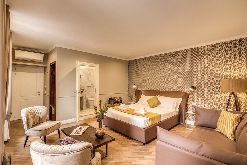 Charme Spagna Boutique Hotel - Tap to explore photos