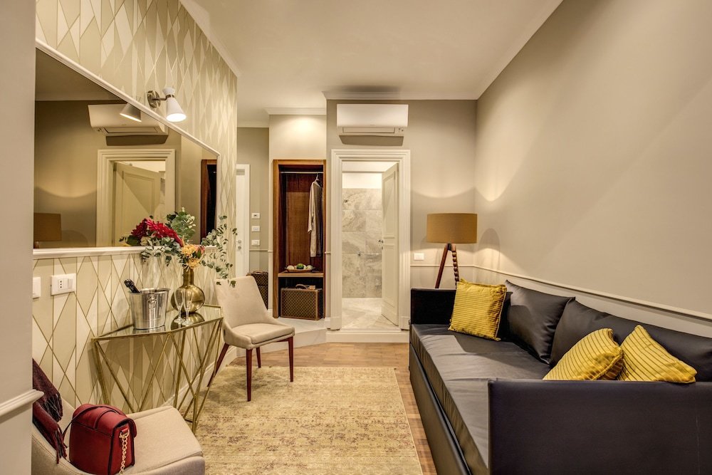 Charme Spagna Boutique Hotel - Tap to explore photos