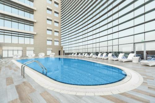 dusitD2 Salwa Doha - Tap to explore photos