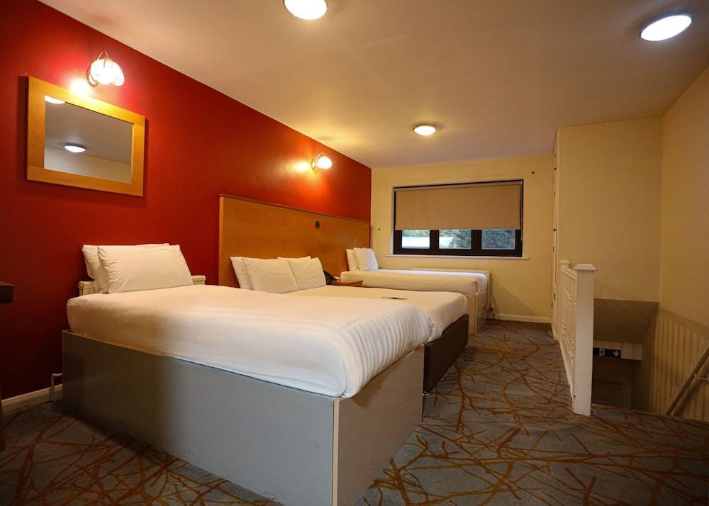 The Tudor Hotel Room Type - Family Room (2 adults + 2 children) The Tudor Hotel Room Type - Family Room (2 adults + 2 children)