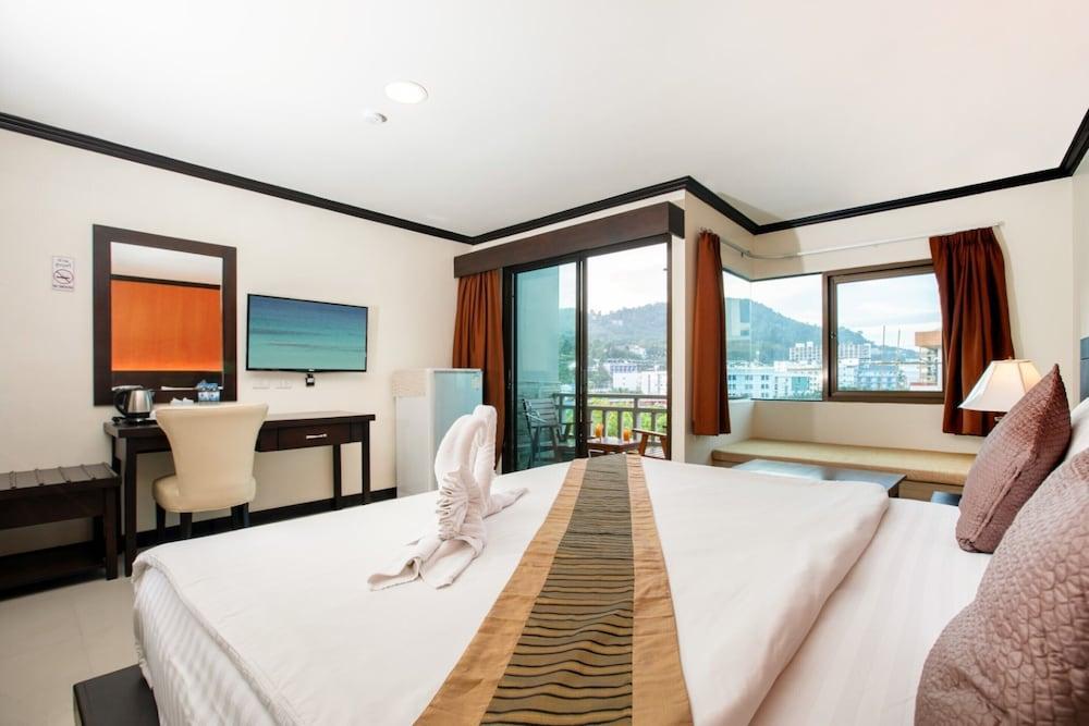 Orchid Garden Hotel Patong - Tap to explore photos