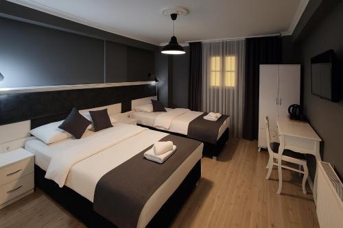 Utarit Taksim Room Type - Economy Triple Room - Basement Floor (No Window)