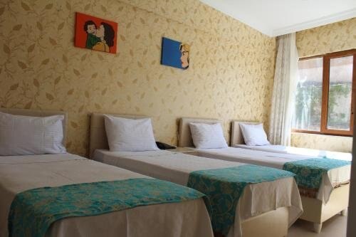 Omega Inn Room Type - Quadruple Room