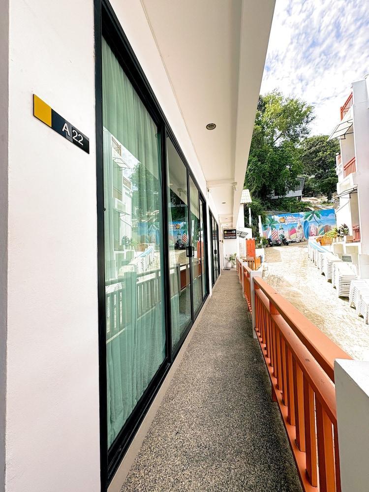 Kata Beachwalk Hotel and Bungalows - Tap to explore photos