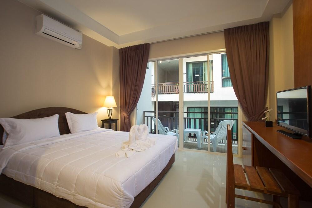 Kata Beachwalk Hotel and Bungalows - Tap to explore photos